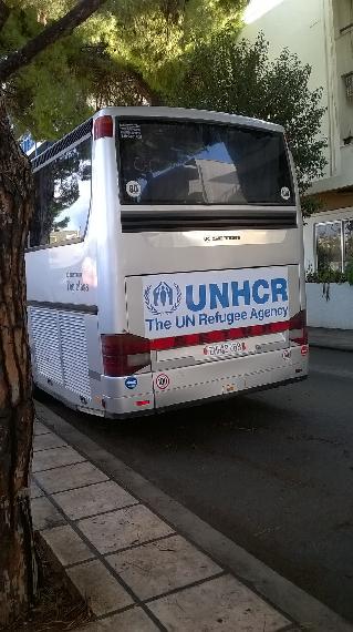 UNHCR bus parked outside hotel where refugees are being accommodated